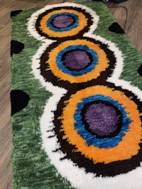 a rug with colorful circles on it